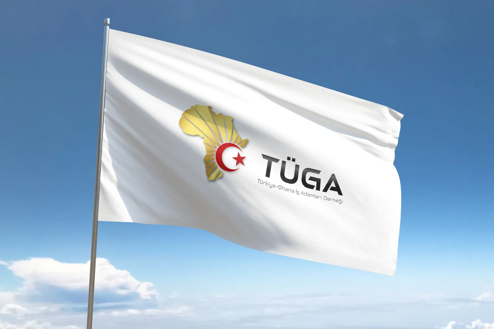 TÜGA logosunu taşıyan kurumsal bayrak, gökyüzü önünde